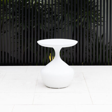 Ubud Outdoor Coffee Table featuring hourglass silhouette and seamless powder-coated aluminium design, shown in White, Charcoal, Rust and Green for modern outdoor styling.