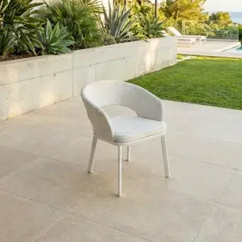 Oliver Outdoor Dining Chair with white aluminium frame and beige Olefin upholstered seat, featuring ribbed back detail.