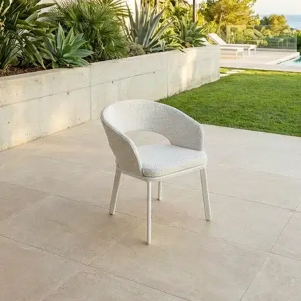 Oliver Outdoor Dining Chair with white aluminium frame and beige Olefin upholstered seat, featuring ribbed back detail.