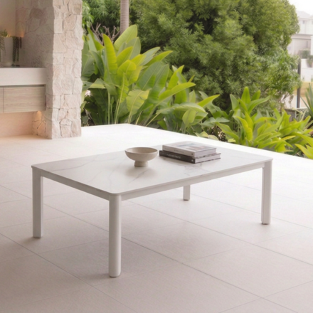 Reyne Outdoor Coffee Table with sintered stone tabletop and powder-coated aluminium frame, available in White and Charcoal