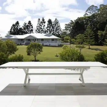 Tropea Extension Large Outdoor Table with powder-coated aluminium frame and slatted tabletop, available in White and Charcoal, designed for large outdoor entertaining.