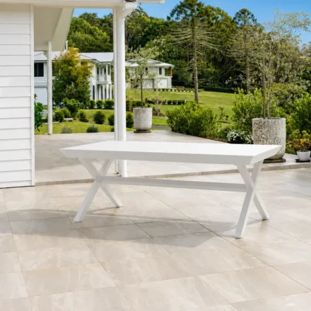 Tropea Extension Medium Outdoor Table with powder-coated aluminium frame and slatted tabletop, available in White and Charcoal, styled for modern outdoor entertaining.