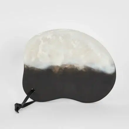resin Halo swirl serving tray - black/white statement piece decor displayed for interior styling.