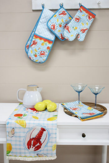 Polyester Table Runner 180cm Lobster with blue gingham and citrus print styled on a white table