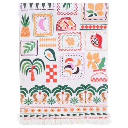 Funky Postcard Polyester Table Runner folded flat displaying the eclectic tropical stamp and motif pattern